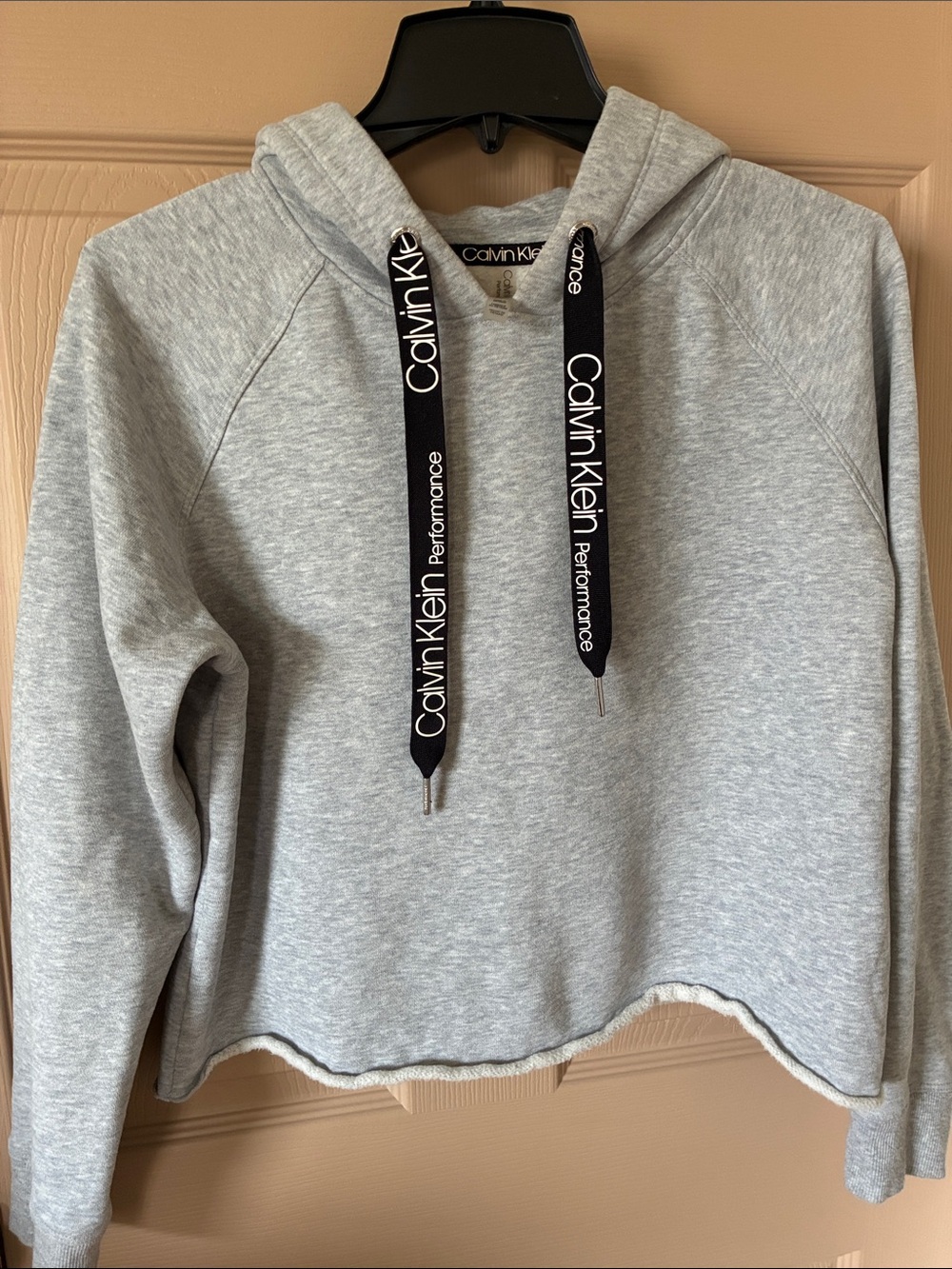 Calvin Klein Light Gray Cropped Performance Hoodie with Black Logo Drawstrings